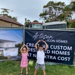 Photo of Our Clients Kids in Front of Our Site Signage